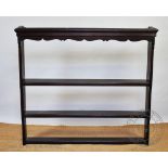 An oak wall hanging shelf rack, with three shelves,