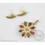 A diamond, ruby, emerald and sapphire set 'snowflake' pendant/brooch,