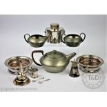 A selection of silver plated wares, comprising a pair of bottle coasters, a fox head stirrup cup,