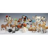 A collection of Beswick and Royal Doulton animals to include three Beswick donkeys,