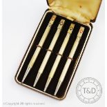 A cased set of four sterling silver Bridge pencils,