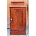 An Edwardian inlaid mahogany bedside pot cupboard, on plinth base,