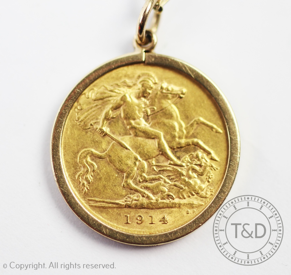 A George V gold half sovereign dated 1914 in a 9ct gold mount and suspended from a fine chain