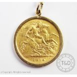 A George V gold half sovereign dated 1914 in a 9ct gold mount and suspended from a fine chain
