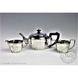 A George V three piece silver tea service, A J Bailey, Birmingham 1933/4 comprising; a teapot,