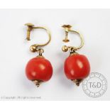 A pair of coral bead set drop earrings, with screw fittings,