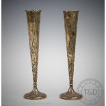 A pair of embossed silver specimen vases, Sheffield 1902, 8cm high,