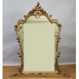 A 19th century style composition over mantle mirror, with shell and scroll moulded frame,