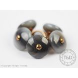 A set of five banded agate set buttons,