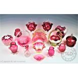 Fourteen pieces of Victorian and later cranberry glass,