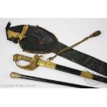 A Naval dress sword, with 79cm Wilkinson & Co acid etched blade and wire mound fish skin type grip,