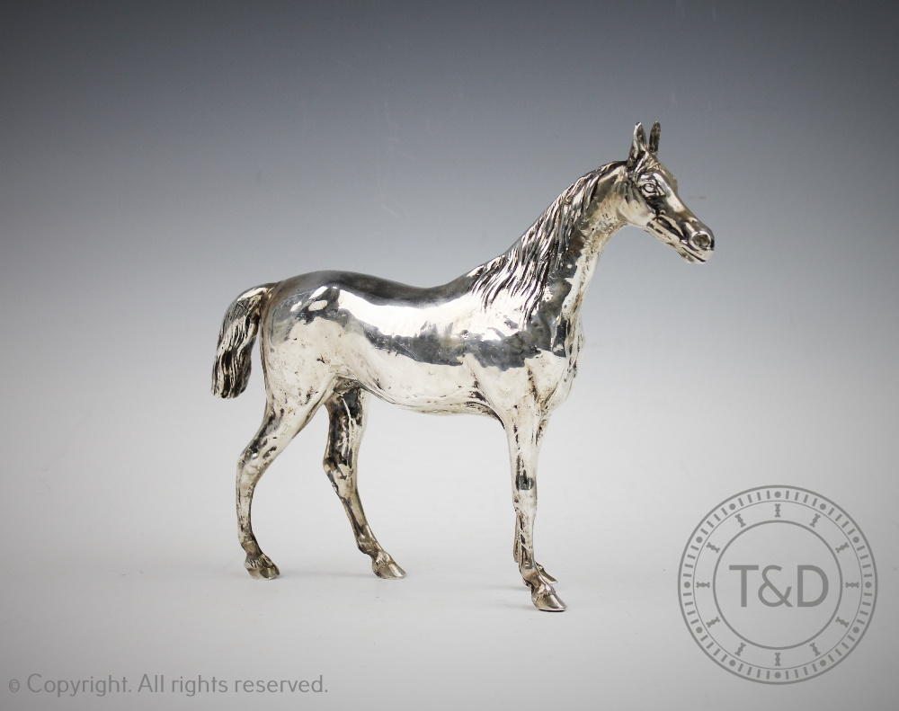 A sterling silver model of a horse, realistically designed standing with textured mane and tail, - Image 2 of 4