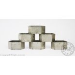 A set of six Tudric pewter napkin rings, probably Liberty & Co,