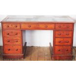 A Victorian mahogany pedestal desk, with an arrangement of nine drawers, on plinth base,