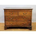 A 19th century and later oak chest, with two short and two long drawers, on bracket feet,