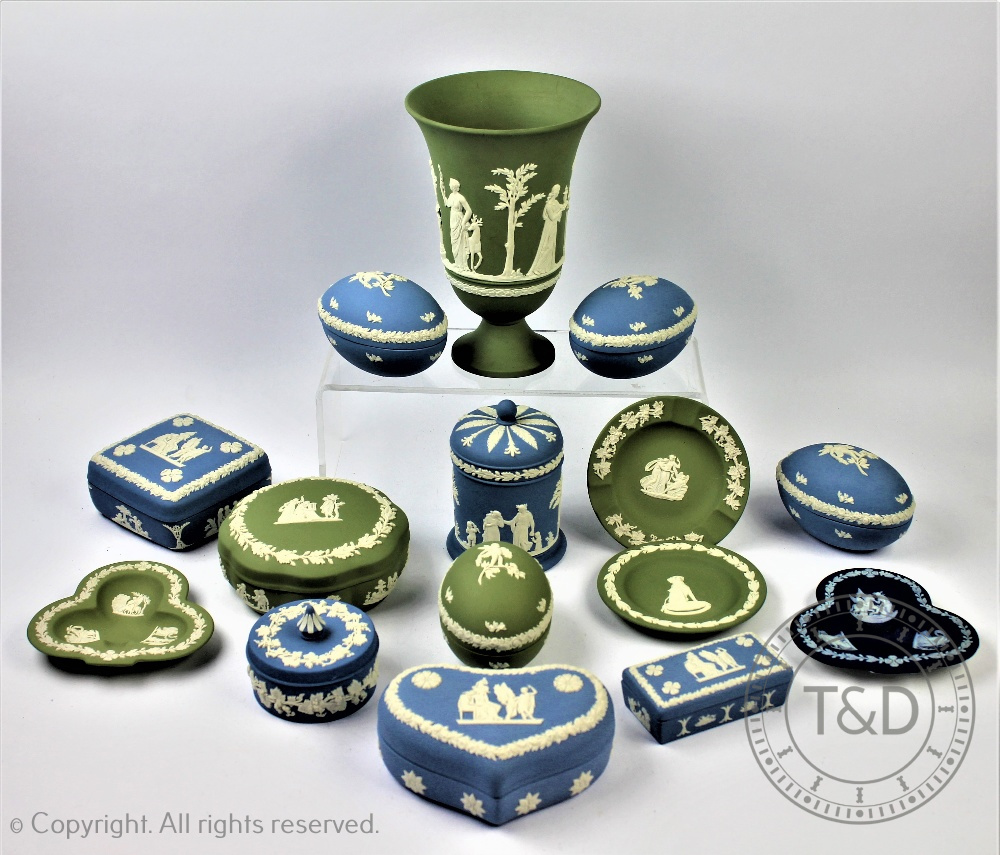 A collection of Wedgwood blue jasper and green cameo ware pieces to include a set of three egg