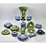 A collection of Wedgwood blue jasper and green cameo ware pieces to include a set of three egg