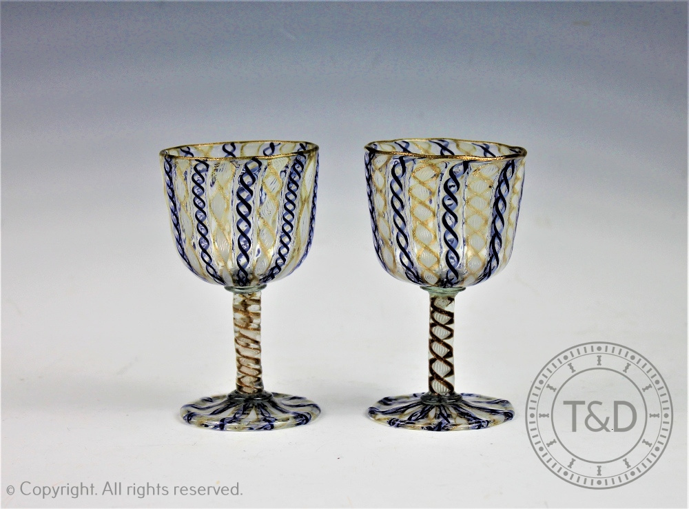 A pair of Italian latticino glass goblets,