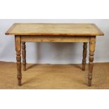A pine country kitchen table, with frieze drawer, on turned legs,