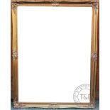 A large modern wall mirror, with bevelled plate within a gilt frame,