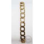 A 9ct yellow gold bracelet, designed as multiple uniform hexagonal links,