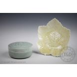A Margaret Frith studio pottery celadon bowl and cover, the cover decorated with floral sprays,