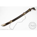 A Malaysian white metal mounted short sword, late 19th / early 20th century, with 58cm blade,
