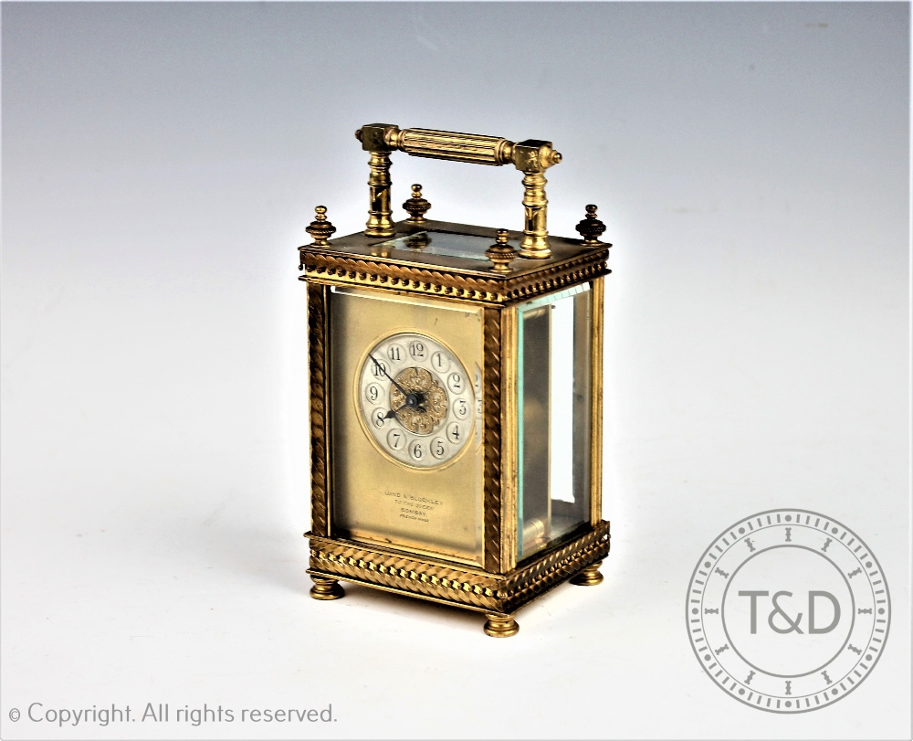 A Lund & Blockley of Bombay lacquered brass carriage timepiece,