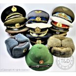 A collection of twelve Russian military and civilion caps and hats,