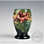 A Moorcroft Lily pattern vase,