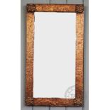 An Arts and Crafts style copper wall mirror,