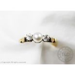 A pearl and diamond three stone ring,