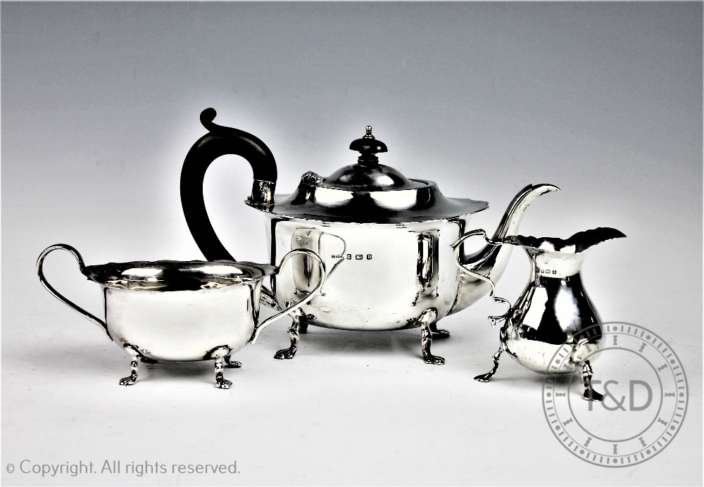 An assembled three pieces silver tea service comprising; a teapot, B Street & Co, Birmingham 1929,