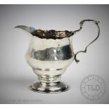 An early George III silver cream jug, London 1764,