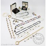 A collection of assorted vintage, costume and modern jewellery, to include beads, brooches,