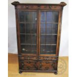 A 1920's oak display cabinet,