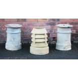 A pair of circular chimney pots, 47cm high,