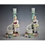 A pair of 20th century Helene Wolfsohn figural candlesticks,