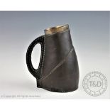 A Douton Lambeth silver mounted jug in the form of a leather jug, Saunders and Shepherd, London,