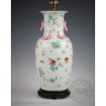 A Chinese famille rose lamp base, decorated with flowers and insects,