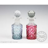Two cut glass scent bottles and stoppers, one with a pink tint the other with a blue tint,
