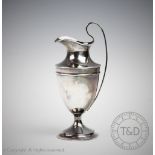 An Edwardian silver jug, Sheffield 1908, of classical form, 14.