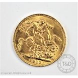 A King George V gold sovereign dated 1911,