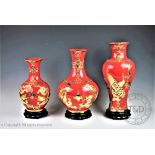 Three contemporary Chinese porcelain gilt overlay vases,
