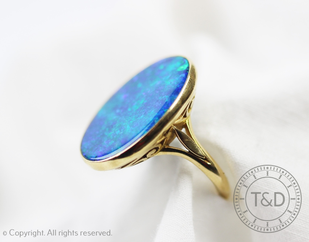 A black opal doublet set ring,