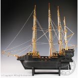 A model of a three masted sailing ship on stand,