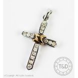 A diamond set cross pendant,