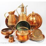 A mixed collection of copper wares, to include an Arts and Crafts style tea pot stand and a footman,