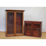 An Edwardian walnut two door display cabinet, no shelves, 92cm H x 69cm W x 34cm D,