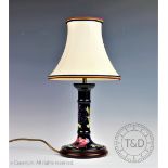 A Moorcroft Anemone pattern candlestick lamp, on wood base, with shade,